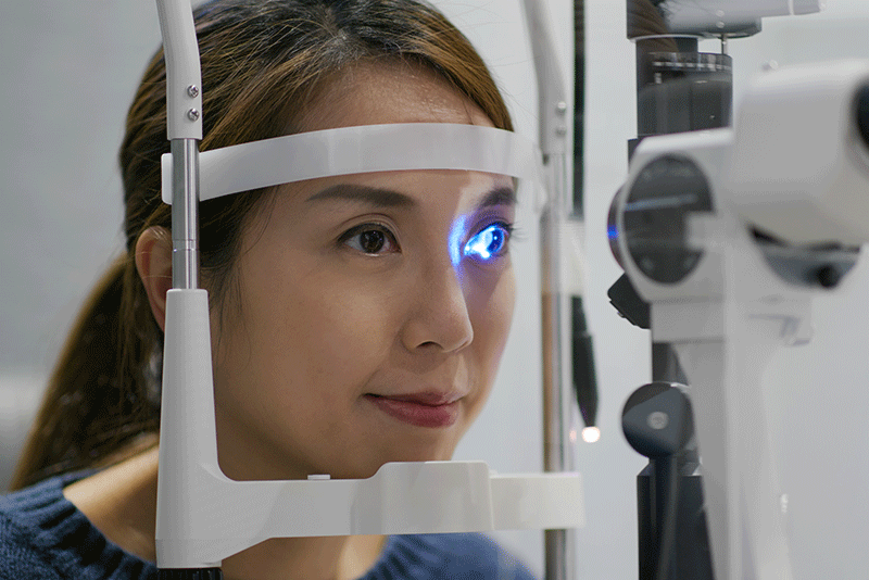 Woman having her eyes examined by an ophthalmologist during an eye check.